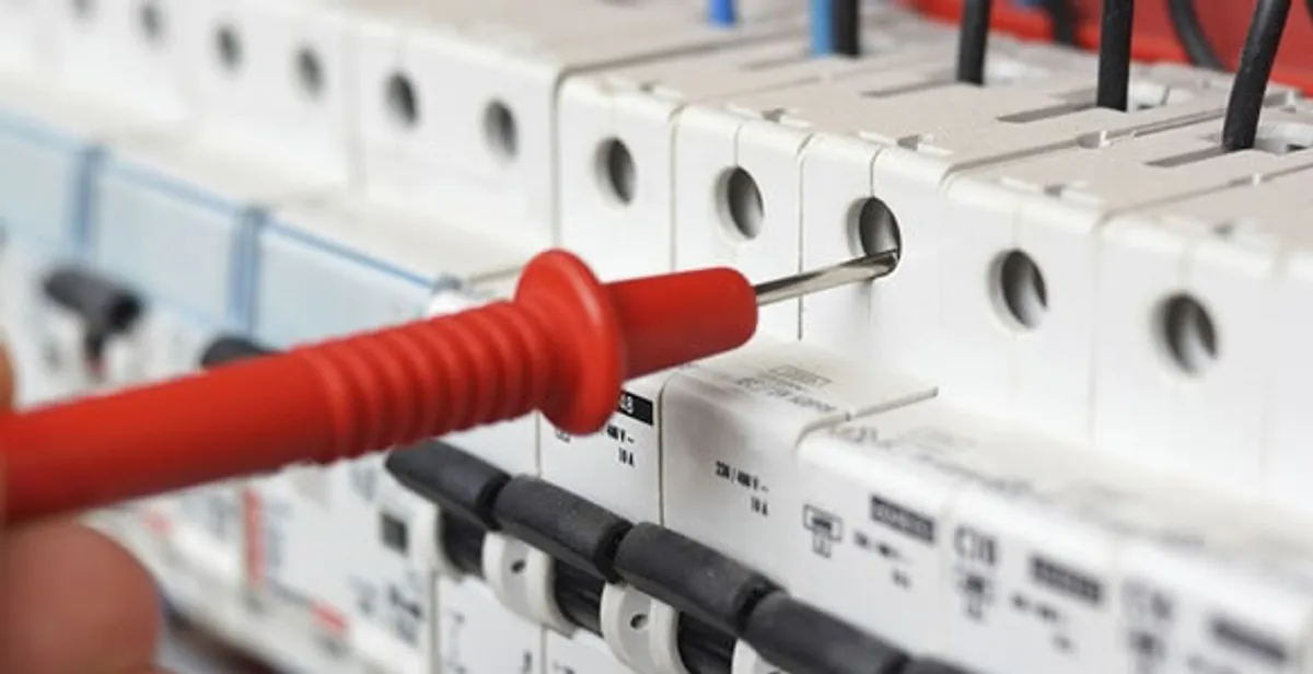 Electrical contractor testing circuit breakers during electrical repair in Henderson, CO