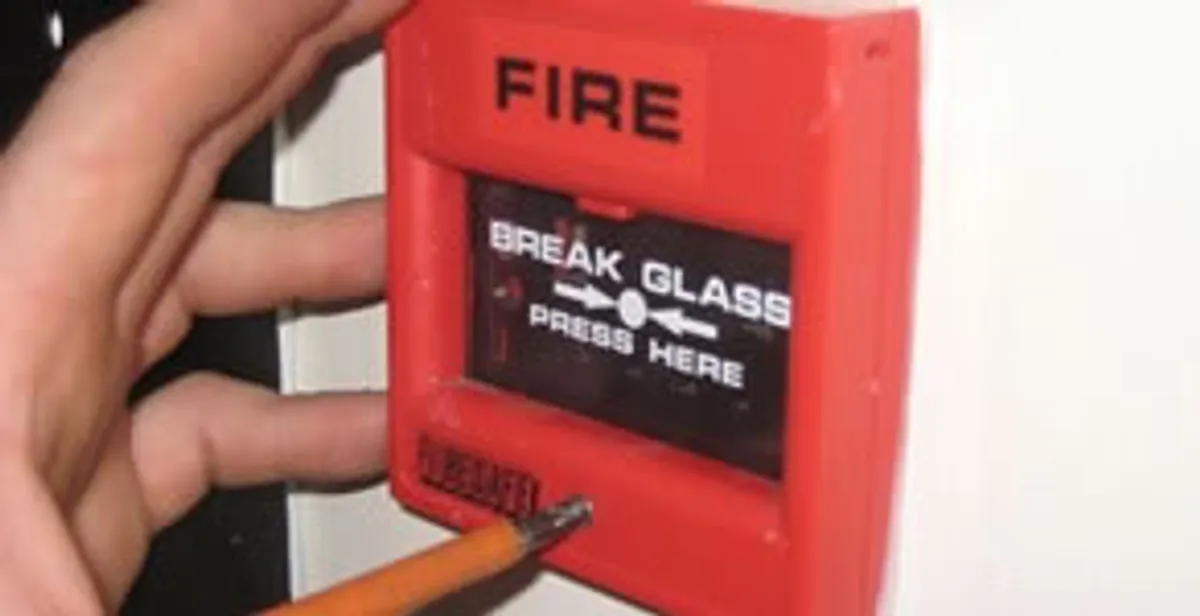 fire alarm installation service showing manual fire alarm pull station installed by licensed electricians in Denver, CO