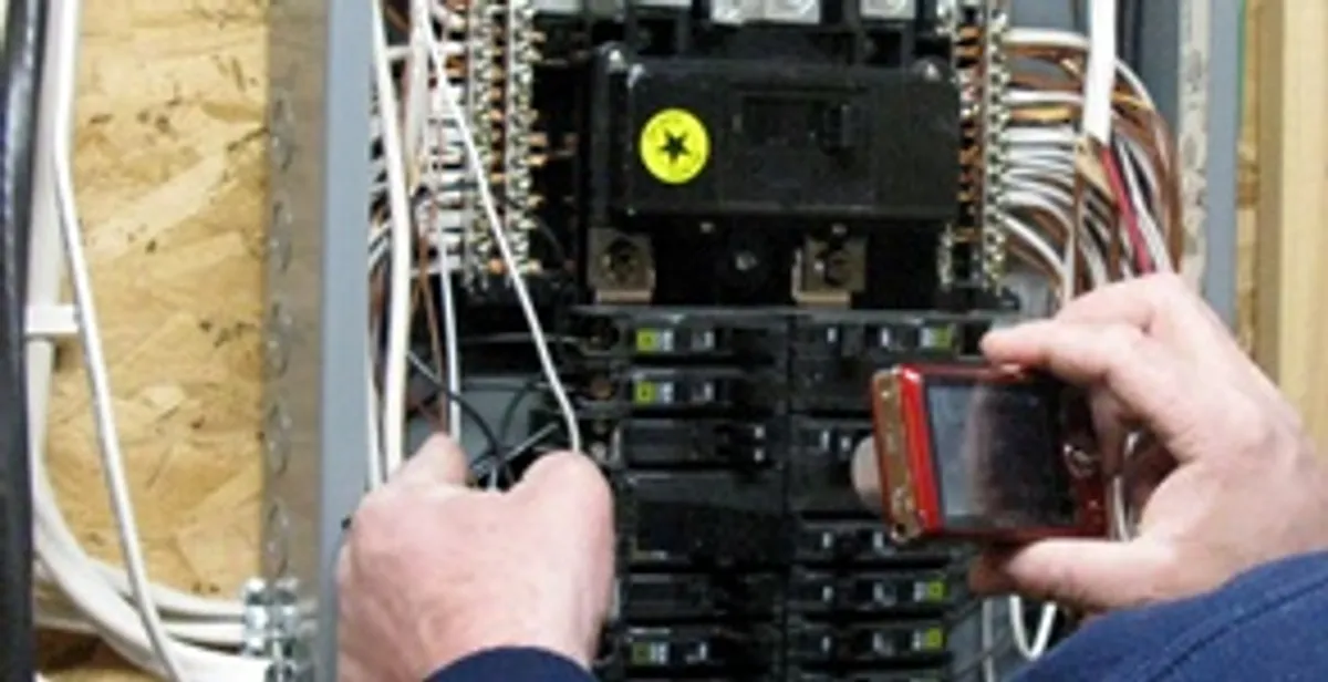 Home electrical inspection of circuit breaker panel by licensed electrician in Denver, CO
